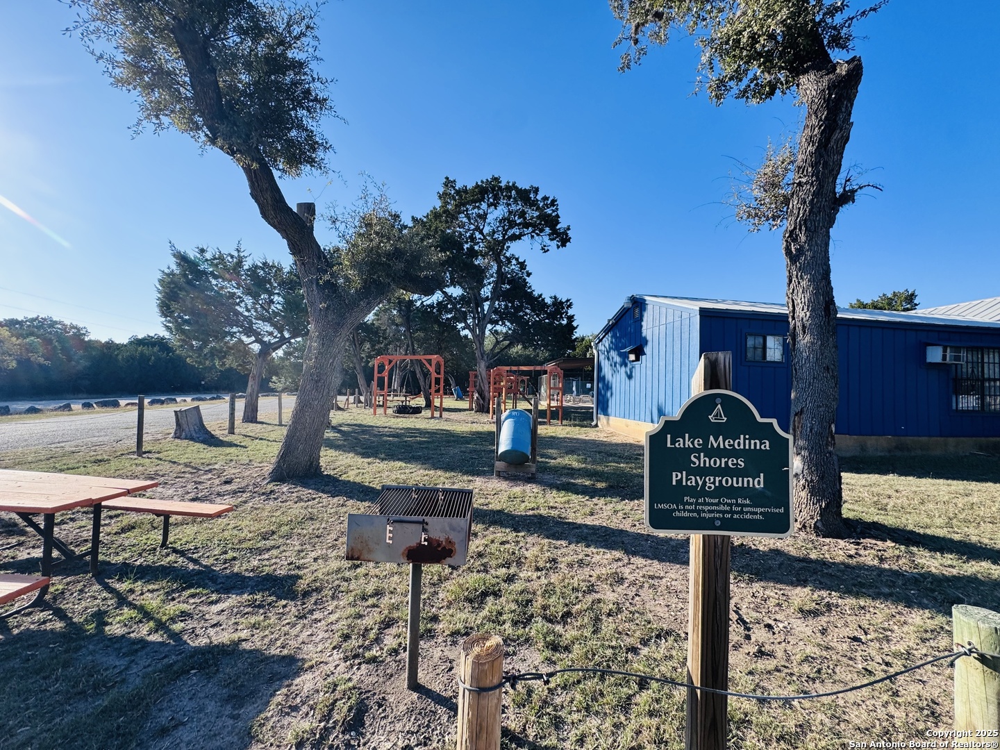 169 Center Point Road Bandera, TX 78003 - Photo 16 of 29 a front view of a house with garden and trees