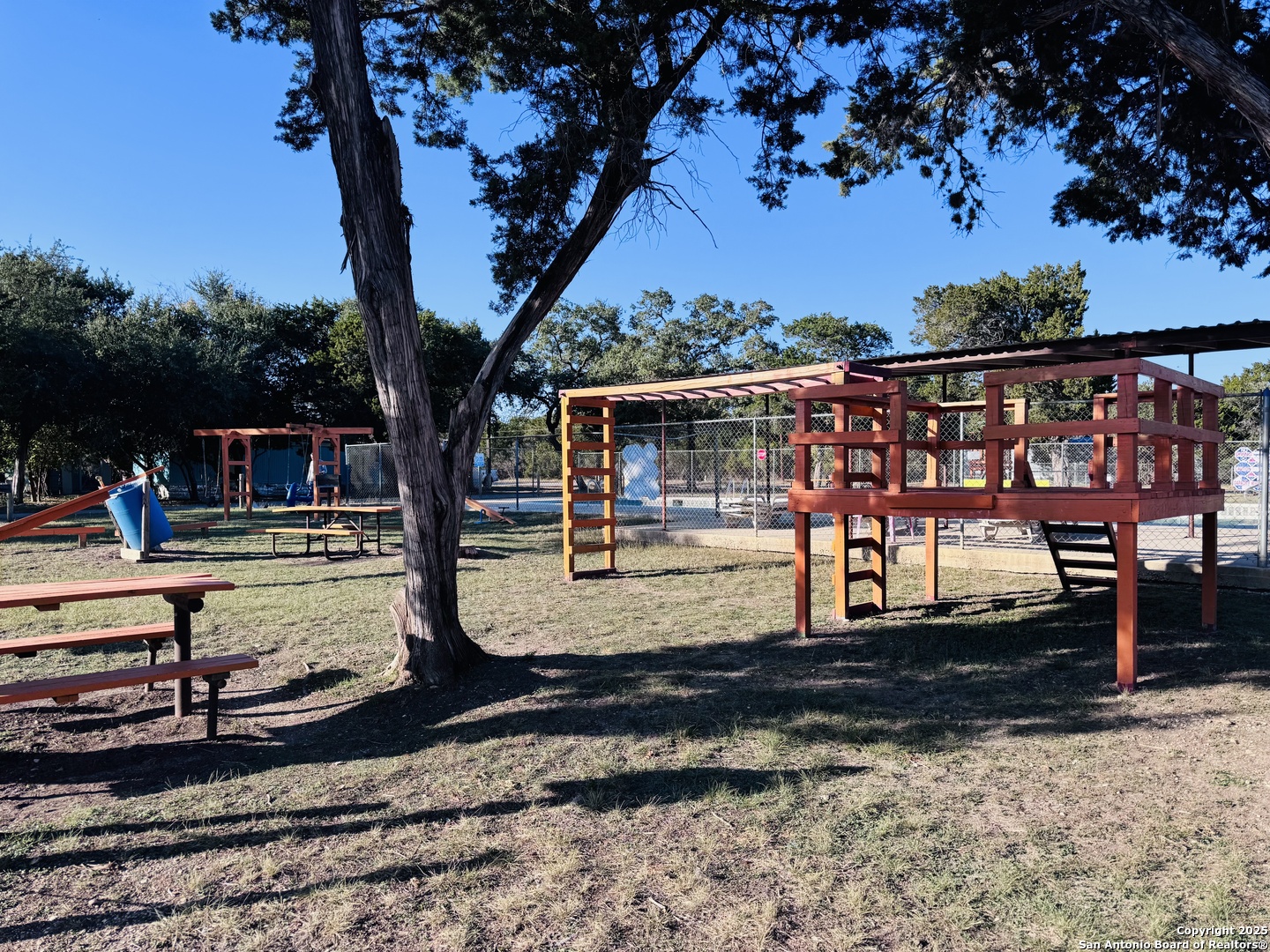 169 Center Point Road Bandera, TX 78003 - Photo 18 of 29 a view of a yard with wooden deck