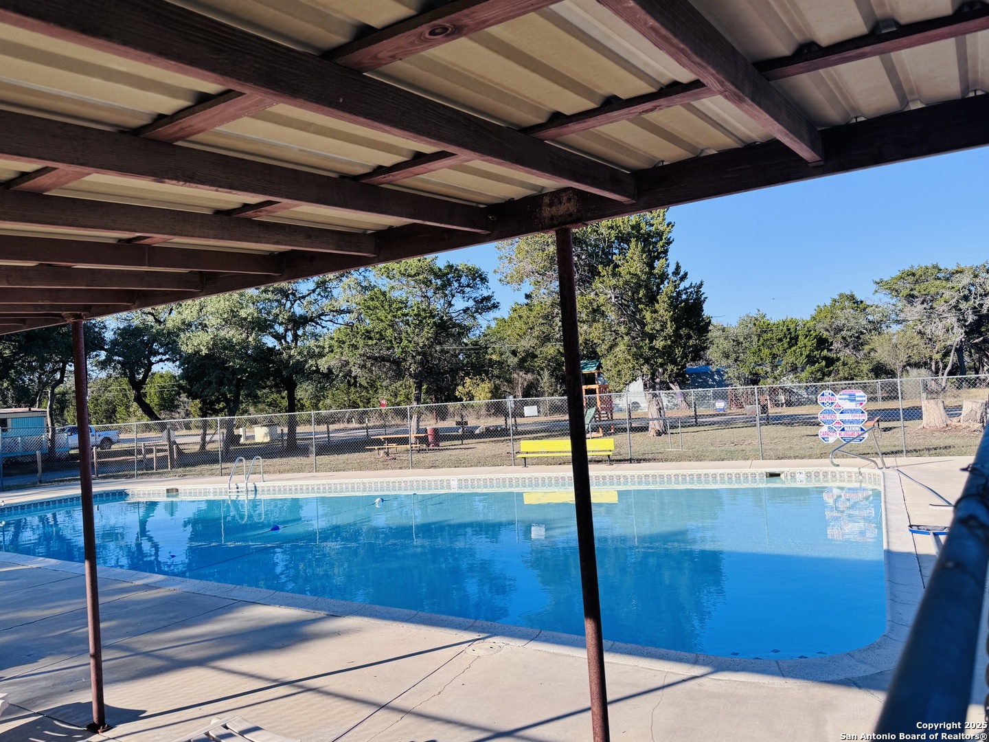 169 Center Point Road Bandera, TX 78003 - Photo 20 of 29 a view of a swimming pool with a patio