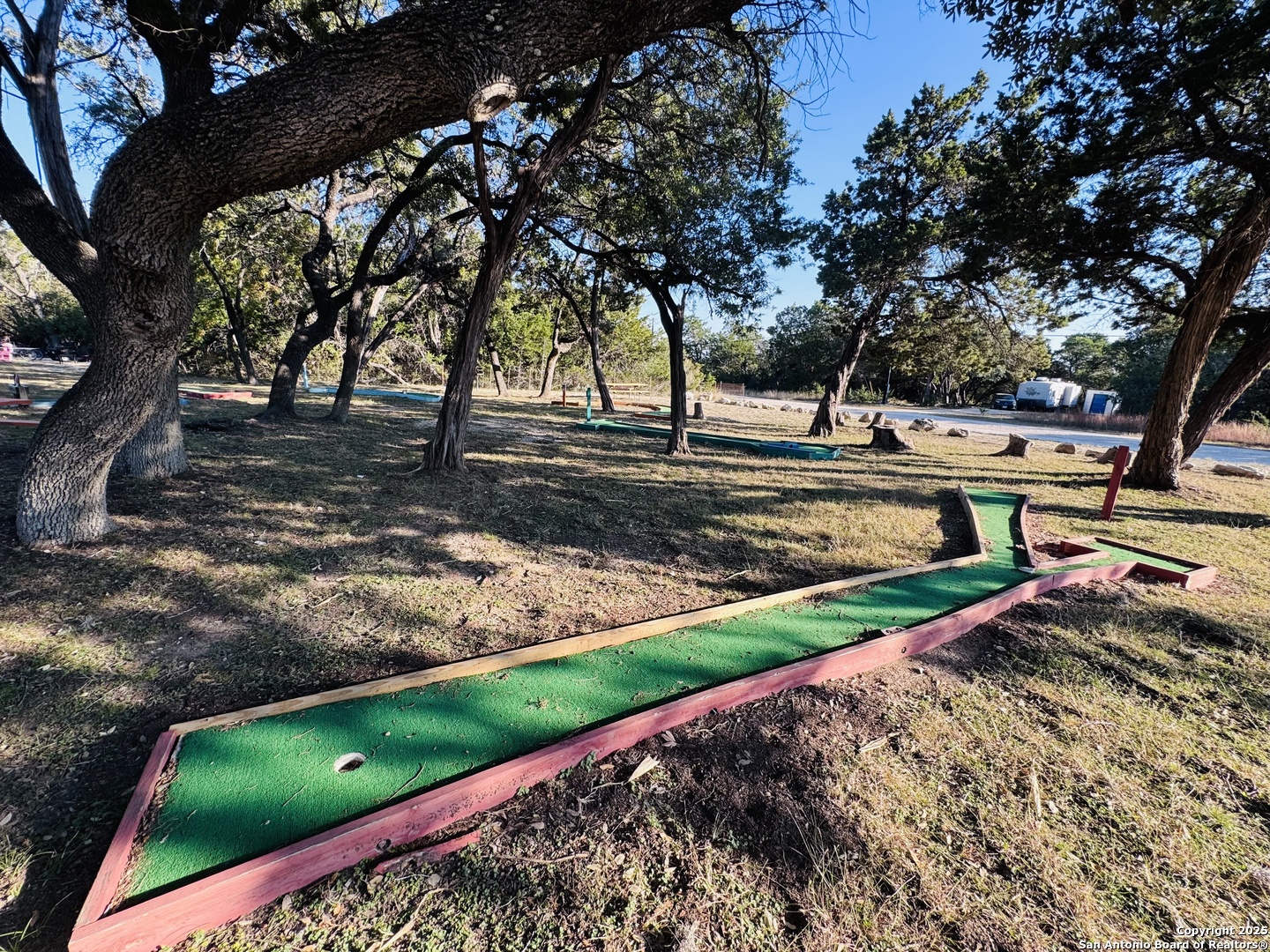 169 Center Point Road Bandera, TX 78003 - Photo 25 of 29 a view of a yard with plants and trees