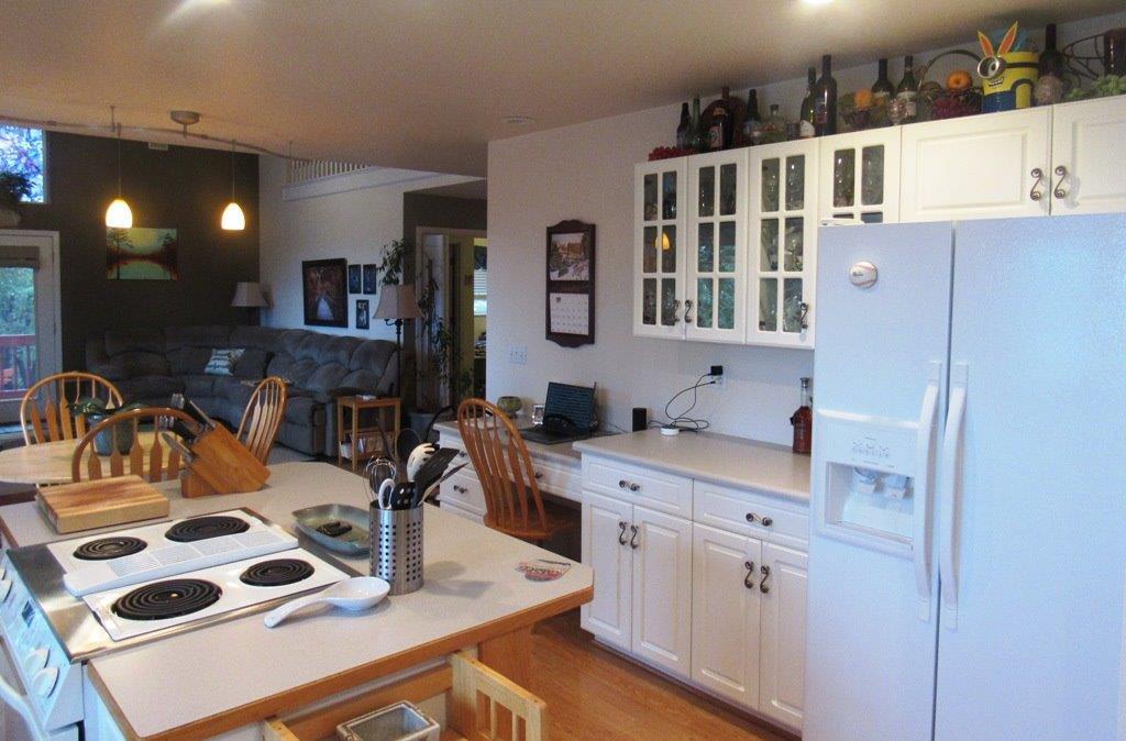 1961 Crow Road Merlin, OR 97532 - Photo 12 of 35 a kitchen with a sink a stove and cabinets