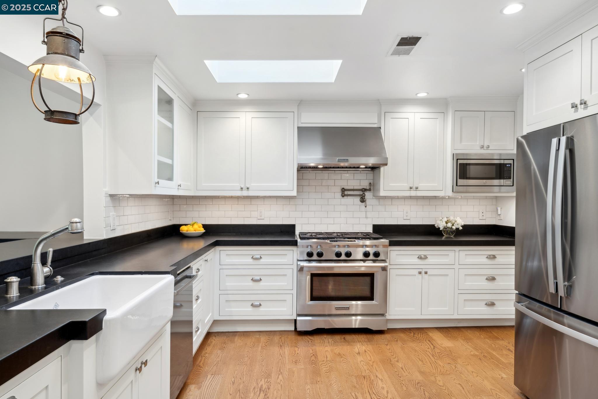 1069 Carol Lane Lafayette, CA 94549 - Photo 3 of 16 Kitchen Opens to Family room with eat at counter