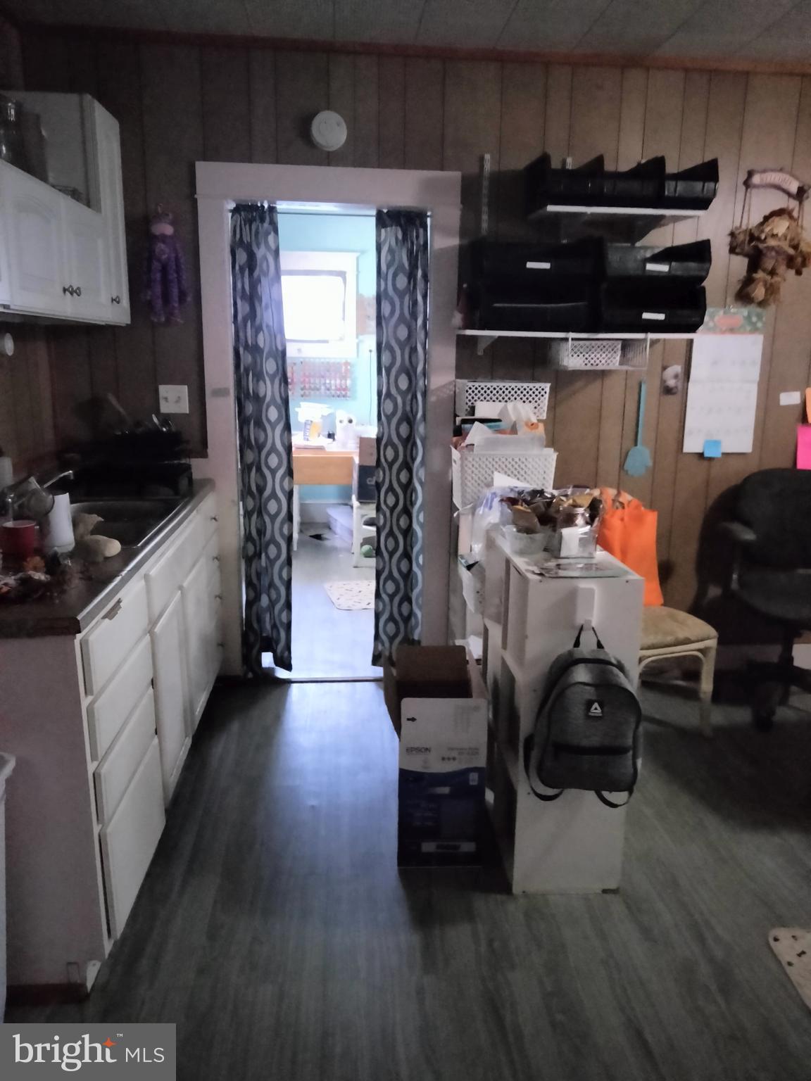 7411 Main Street Willards, MD 21874 - Photo 29 of 43 a kitchen with furniture cabinets and a stove top oven