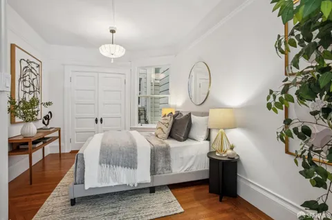 a bedroom with bed and a window