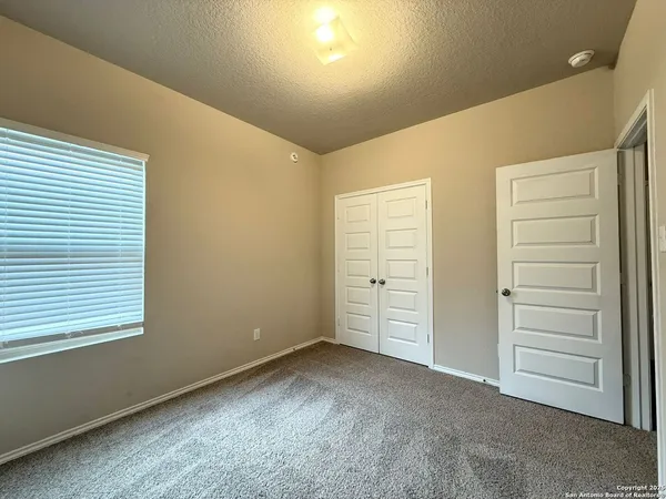 a view of room with closet and utility room