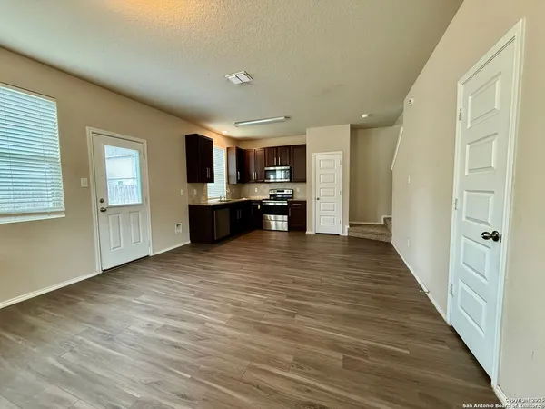 a view of a kitchen from the hallway