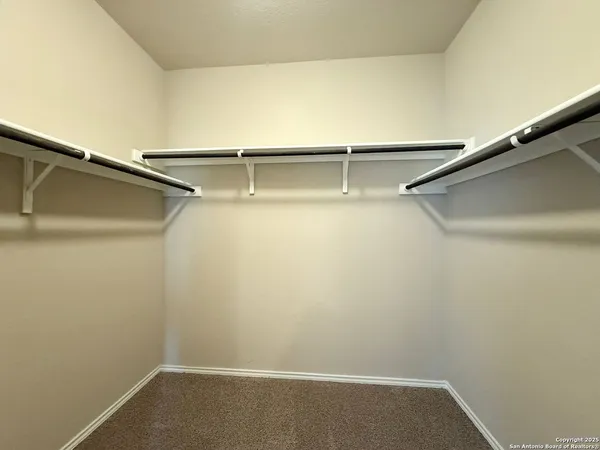 a view of an empty walk in closet