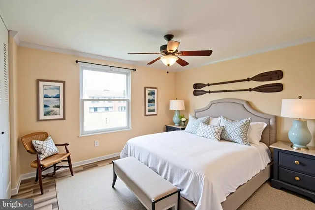 a bedroom with a bed and chair