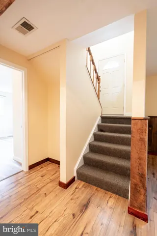 a view of entryway with wooden floor