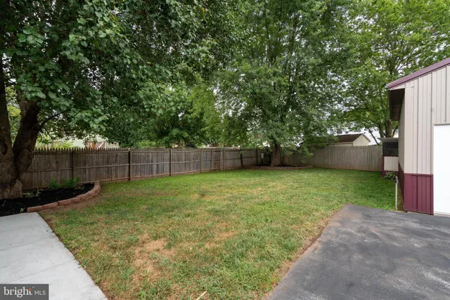 a view of a kitchen with furniture and a ceiling fan