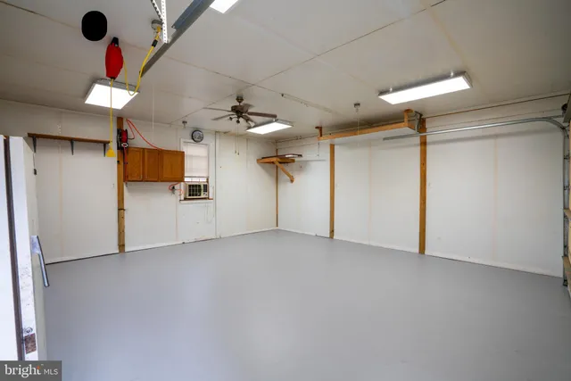 a view of backyard with trampoline