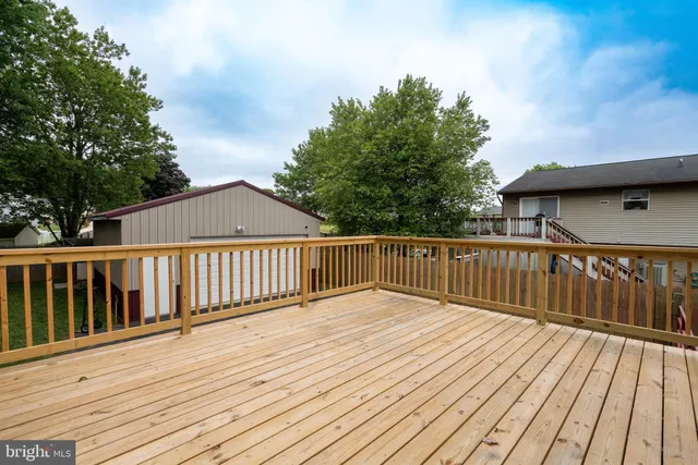 a front view of a house with a yard and porch
