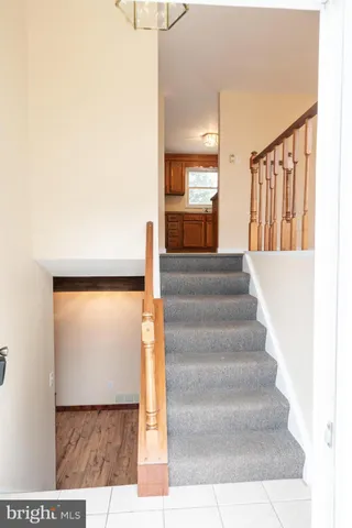 a view of staircase with white walls