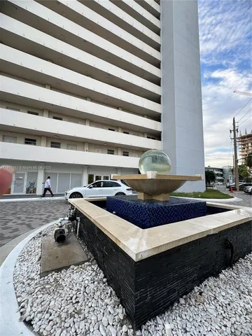 a living room with a couch and dresser