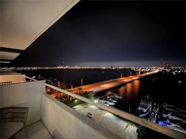 a bathroom with a granite countertop sink and toilet