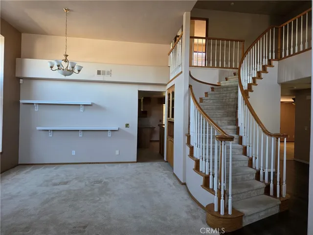 a view of a hallway with staircase