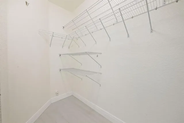 a view of a room with racks on the wall