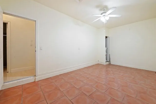 an empty room with fan