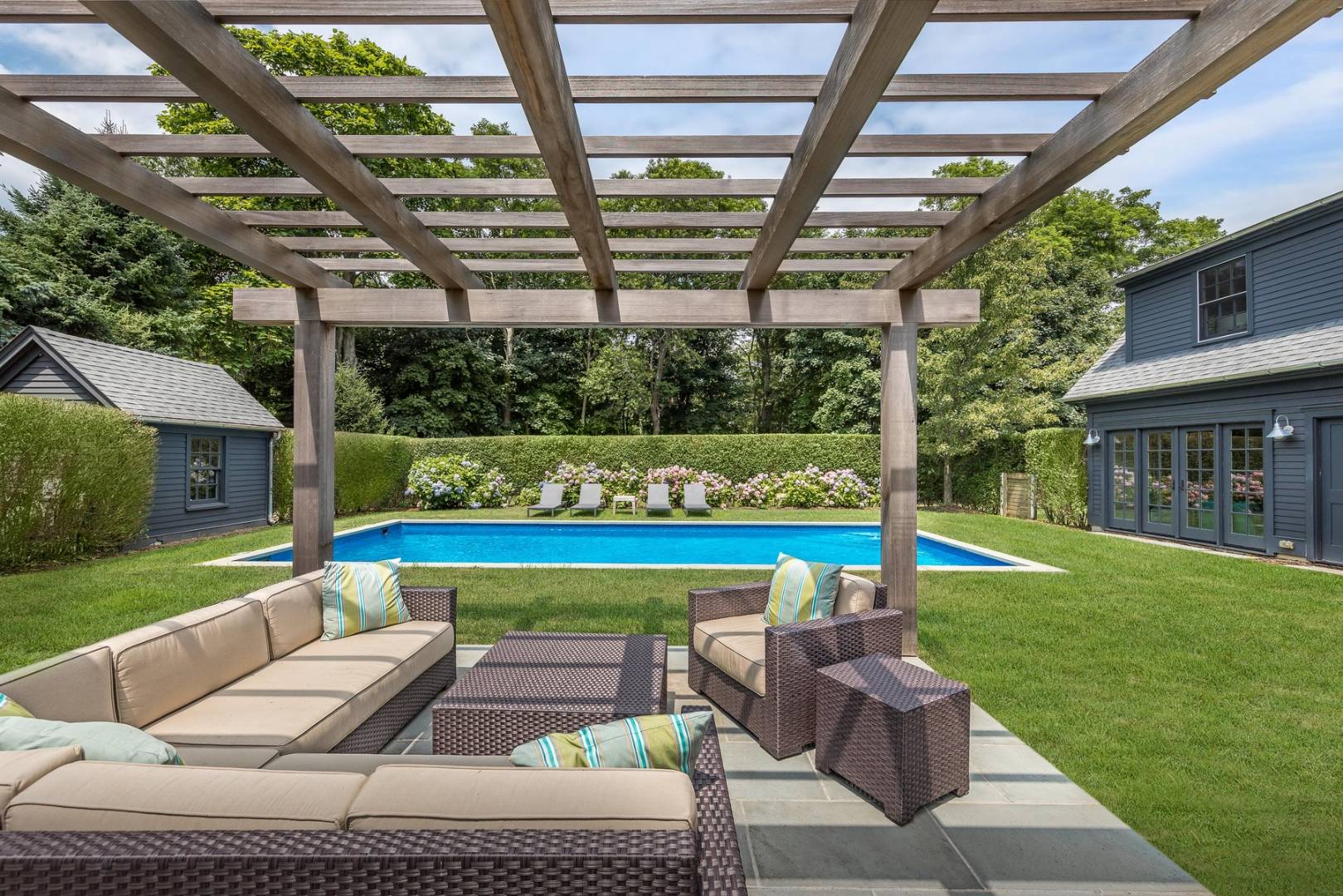 a view of patio with couches and pool