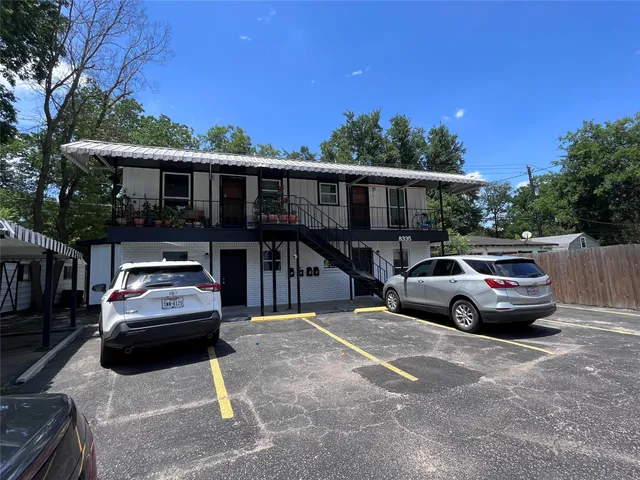 a car parked in front of a house