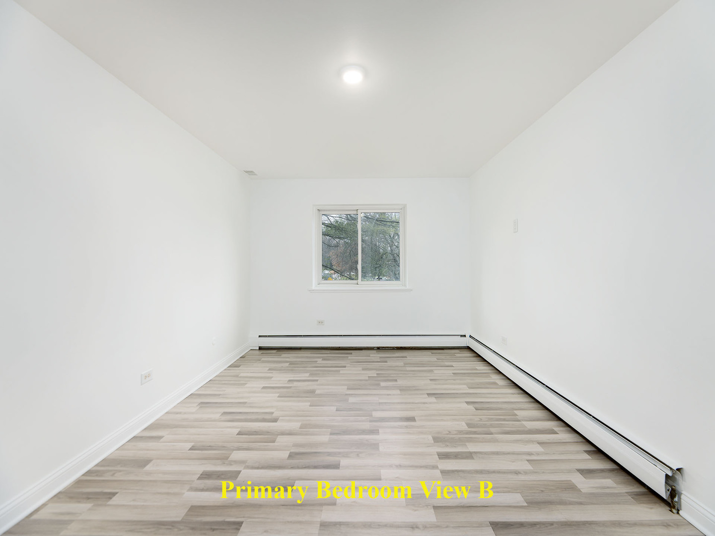 2315 East Olive Street, Unit 2B Arlington Heights, IL 60004 - Photo 17 of 30 a view of an empty room and window