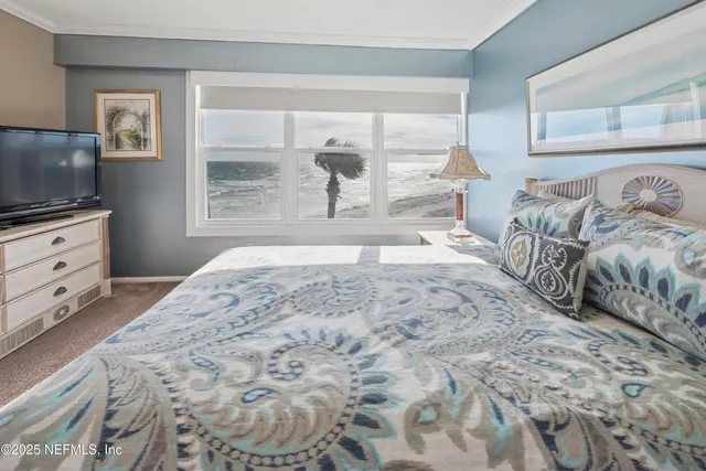 a spacious bedroom with two beds and a couch