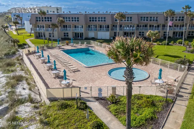 a view of a balcony with chairs