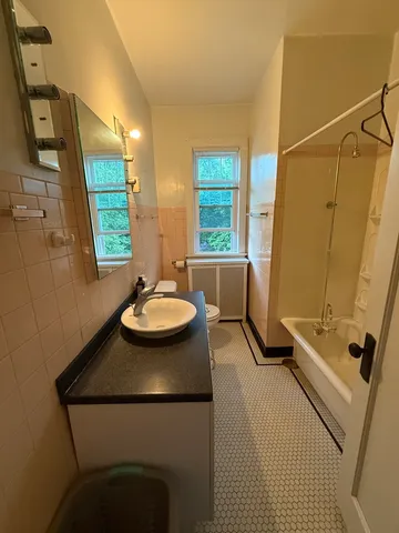 a view of a bathroom with a sink and mirror