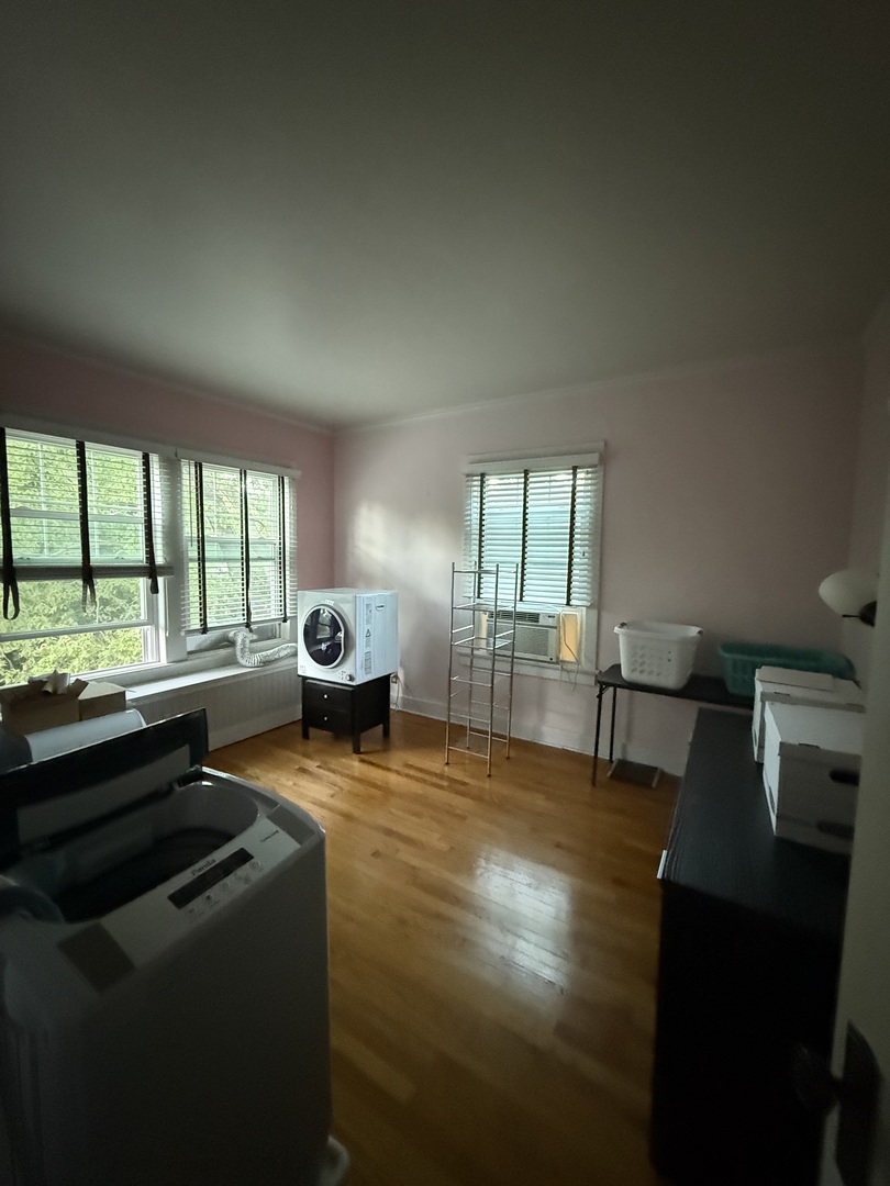 706 South Coler Avenue, Unit 5 Urbana, IL 61801 - Photo 15 of 21 a living room with furniture and a large window