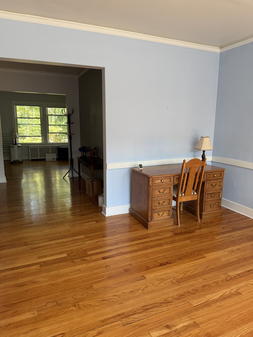 706 South Coler Avenue, Unit 5 Urbana, IL 61801 - Photo 18 of 21 a living room with furniture and a wooden floor