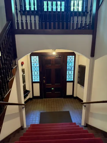 a view of an entryway with wooden floor