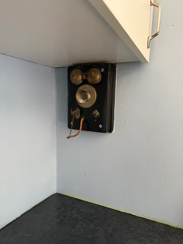 a room with a wooden floor and white wall