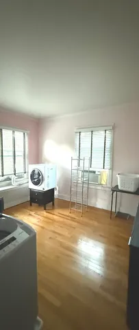 a view of a living room and a large window