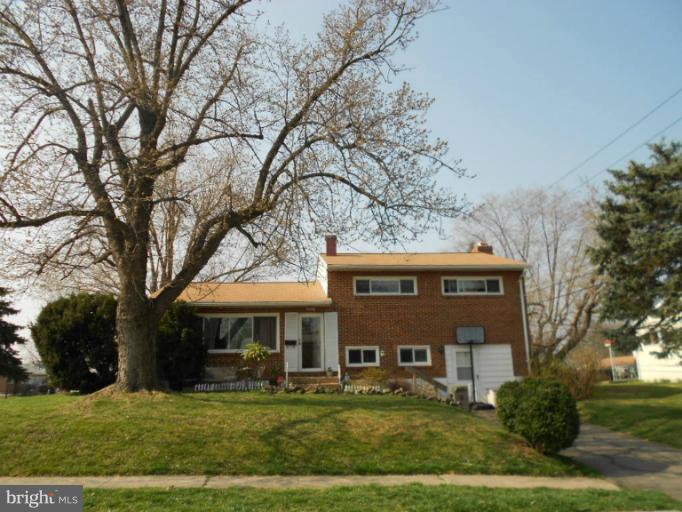 5901 Robindale Road Catonsville, MD 21228 - Photo 1 of 15 a front view of a building with garden
