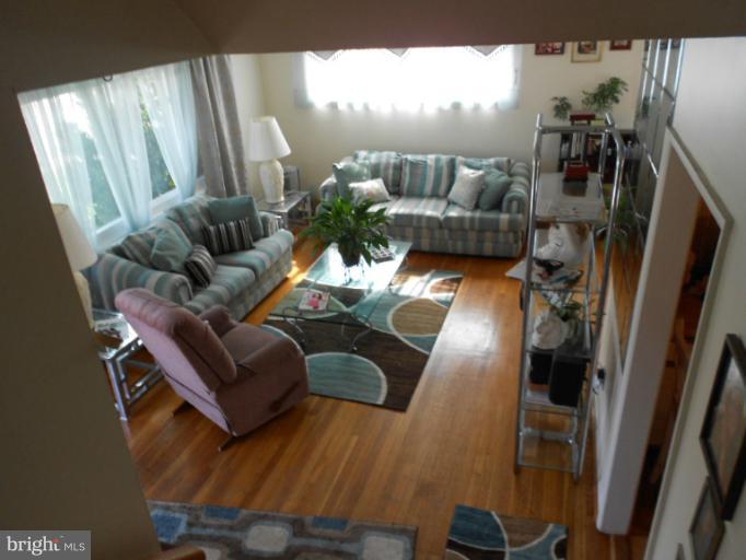 5901 Robindale Road Catonsville, MD 21228 - Photo 3 of 15 a living room with furniture and a floor to ceiling window