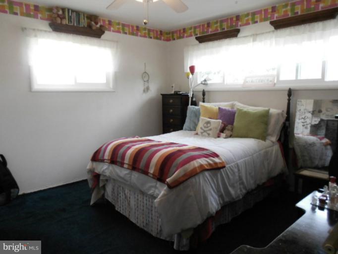 5901 Robindale Road Catonsville, MD 21228 - Photo 9 of 15 a bedroom with a bed and window