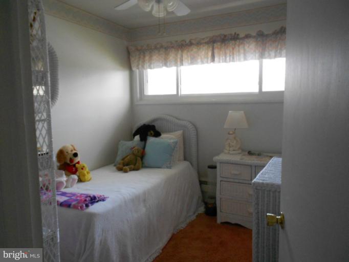 5901 Robindale Road Catonsville, MD 21228 - Photo 10 of 15 a bedroom with a bed and window