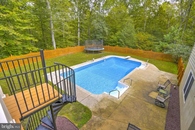 a view of a balcony with floor to ceiling windows