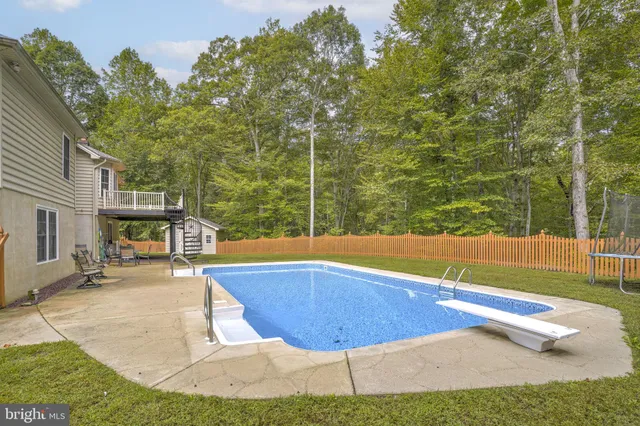 a view of a swimming pool with an outdoor space