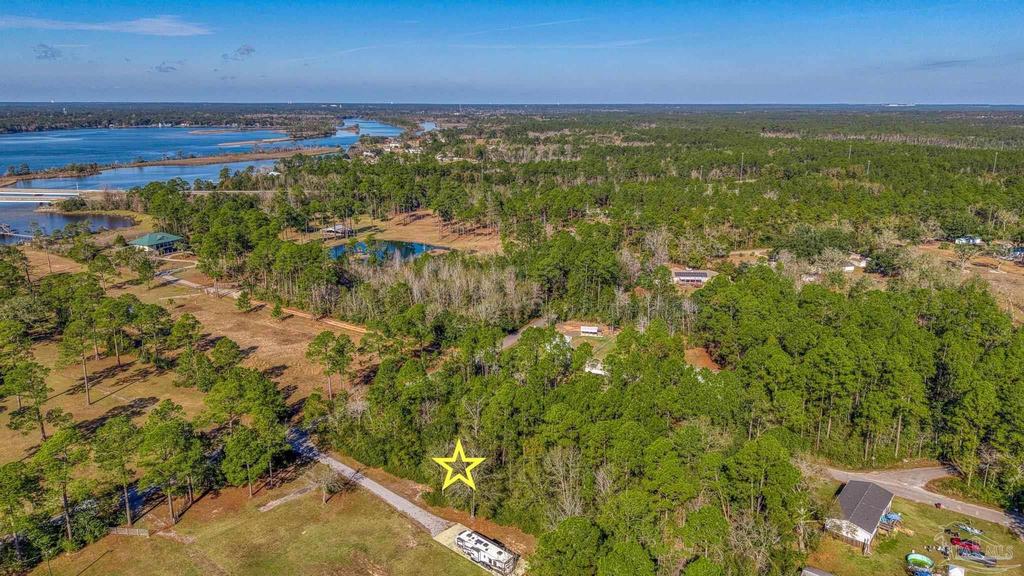 2 Petersen Point Road Milton, FL 32583 - Photo 6 of 15 a view of an outdoor space and a lake view