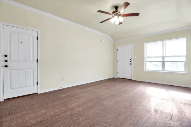 a kitchen with a refrigerator sink and white cabinets