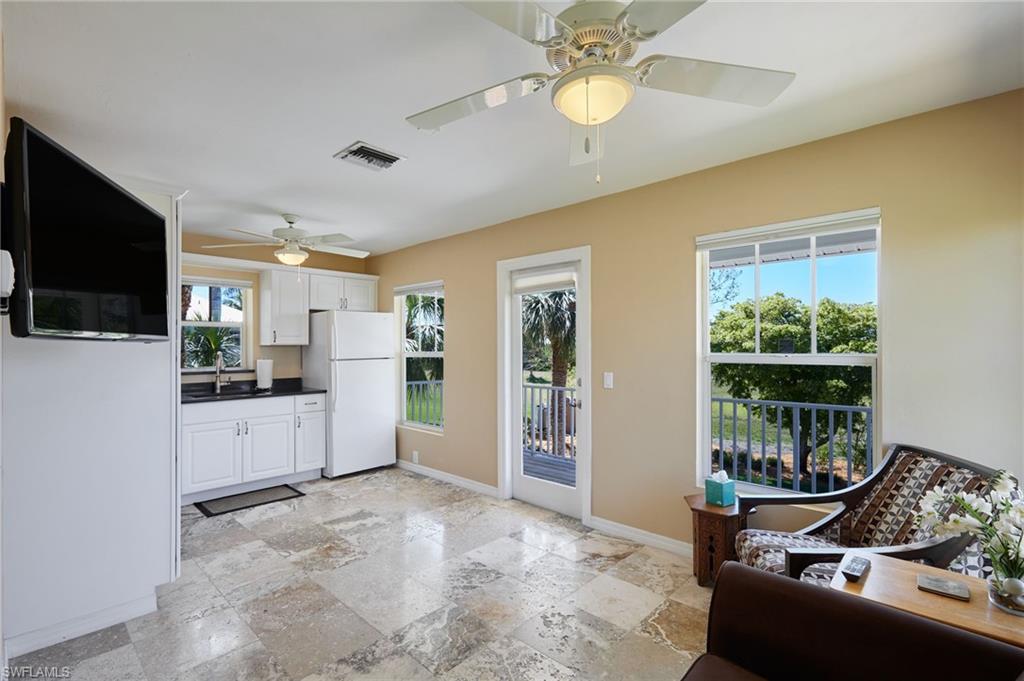 18481 Pioneer Road Fort Myers, FL 33908 - Photo 36 of 44 Living/kitchen area with door to the deck.