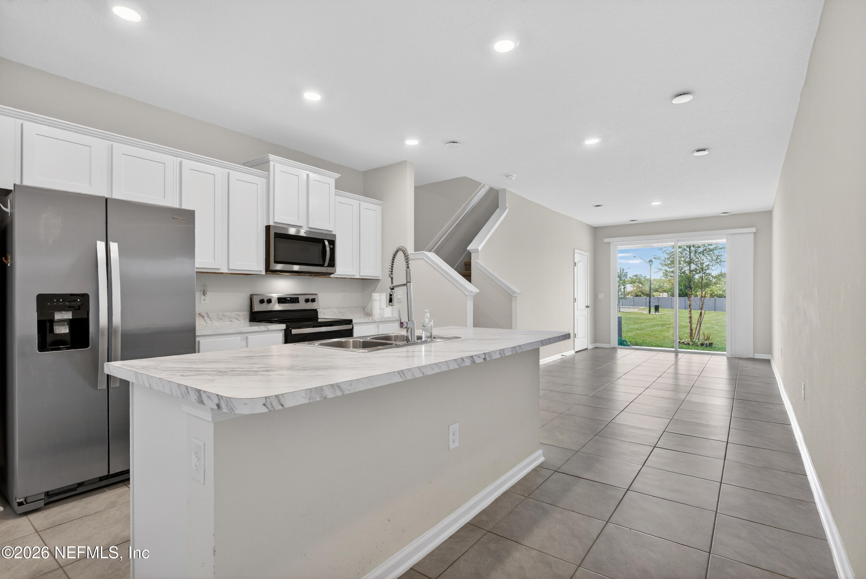 8210 Larose Road Jacksonville, FL 32211 - Photo 4 of 38 a kitchen with a sink a counter top space cabinets and stainless steel appliances