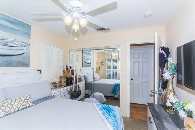 a bedroom with furniture and a chandelier