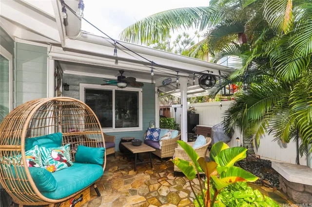 a view of a chair and tables in the patio