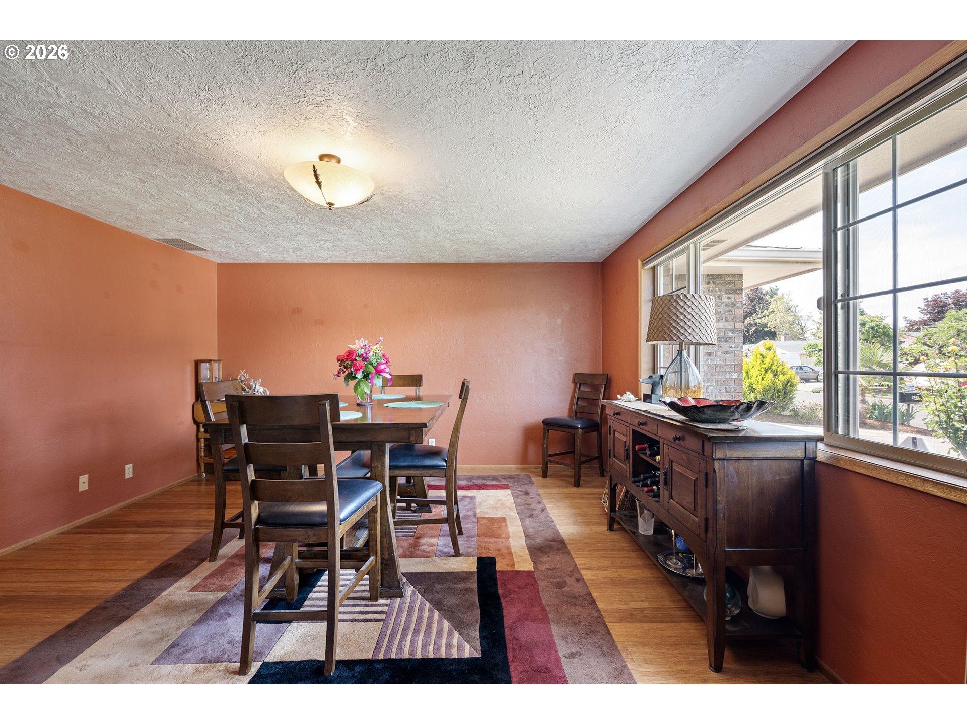 2465 17th Street Springfield, OR 97477 - Photo 20 of 47 a view of a dining room with furniture a chandelier and wooden floor