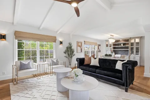 a living room with furniture and a table