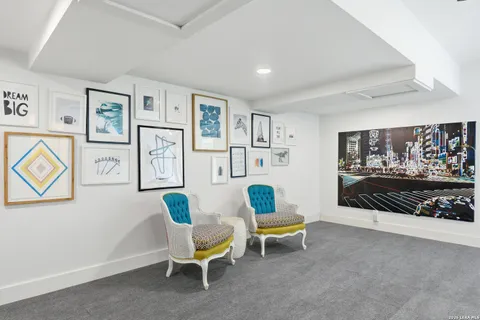 a living room with furniture and white walls