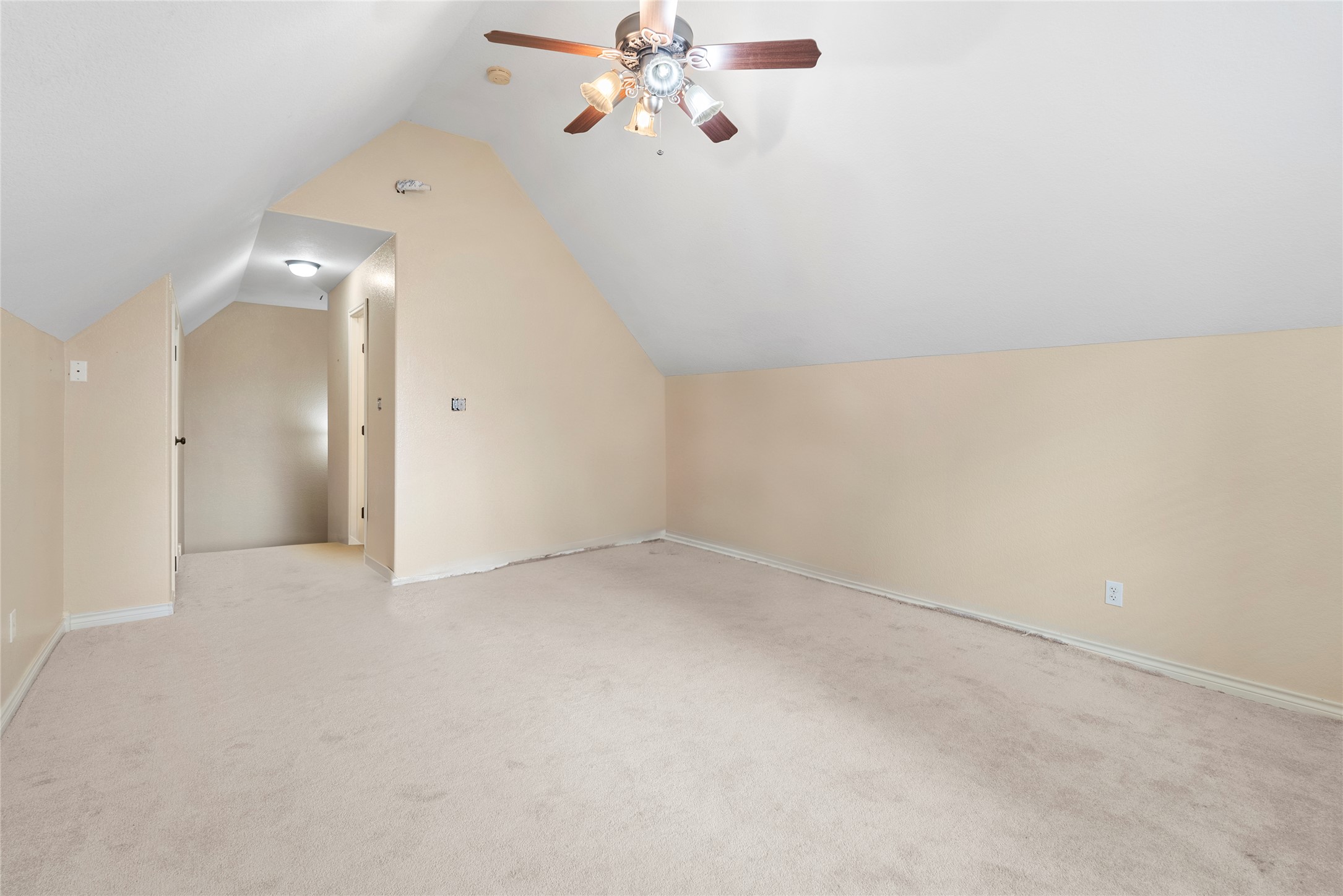 330 Arbors Circle Elgin, TX 78621 - Photo 27 of 36 Bonus room featuring lofted ceiling, a ceiling fan, and light colored carpet