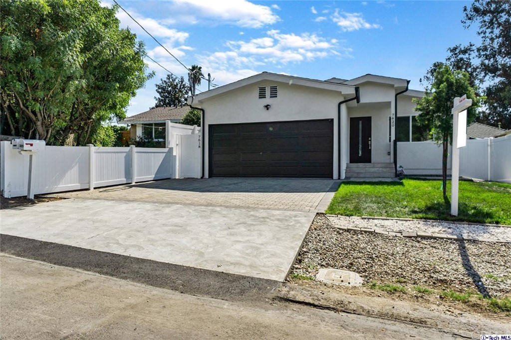 7618 Kyle Street Tujunga, CA 91042 - Photo 1 of 1 a front view of a house with a garden